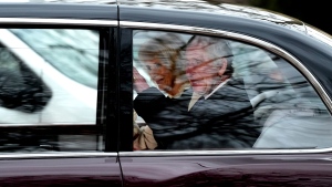 King Charles III waves as he and Queen Camilla leave Clarence House by car in London, Tuesday, Feb. 6, 2024. Buckingham Palace announced Monday evening that the king has begun outpatient treatment for an undisclosed form of cancer. (AP Photo/Frank Augstein)