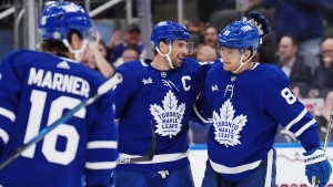 Toronto Maple Leafs forward John Tavares (91) celebrates his goal against the Dallas Stars with forward William Nylander (88) during second period NHL hockey action in Toronto on Wednesday, February 7, 2024. THE CANADIAN PRESS/Nathan Denette