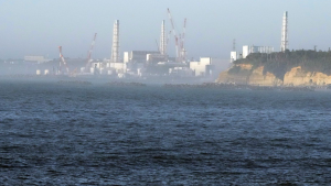 The Fukushima Daiichi nuclear power plant, damaged by a massive March 11, 2011, earthquake and tsunami, is seen from the nearby Ukedo fishing port in Namie town, northeastern Japan, on Aug. 24, 2023. (AP Photo/Eugene Hoshiko)