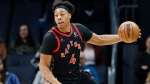 FILE - Toronto Raptors forward Scottie Barnes brings the ball up court during the first half of an NBA basketball game against the Charlotte Hornets in Charlotte, N.C., Wednesday, Feb. 7, 2024. (AP Photo/Nell Redmond) 