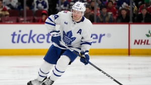 Toronto Maple Leafs defenseman Morgan Rielly handles the puck during the second period of an NHL hockey game against the Chicago Blackhawks Friday, Nov. 24, 2023, in Chicago. (AP Photo/Erin Hooley) 