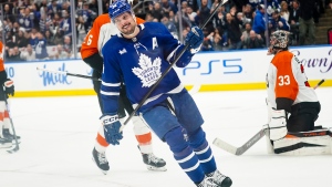 Toronto Maple Leafs centre Auston Matthews (34) celebrates after scoring a goal against the Philadelphia Flyers during second period NHL hockey action in Toronto on Thursday, Feb. 15, 2024. THE CANADIAN PRESS/Arlyn McAdorey