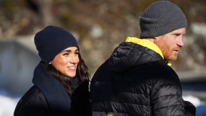 Prince Harry and Meghan Markle, the Duke and Duchess of Sussex, walk together after Harry slid down the track on a skeleton sled while attending an Invictus Games training camp, in Whistler, B.C., on Thursday, February 15, 2024. Invictus Games Vancouver Whistler 2025 is scheduled to take place from Feb. 8 to 16, 2025 and will for the first time feature winter sports. THE CANADIAN PRESS/Darryl Dyck