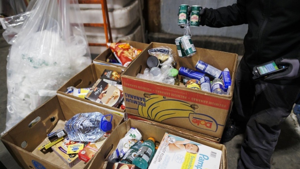 Food and goods are sorted to be sent to a food bank at a Metro grocery store In Toronto on Friday, Feb. 2, 2024. THE CANADIAN PRESS/Cole Burston