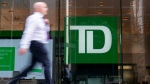 A person makes their way past a Toronto-Dominion Bank branch in Toronto, Monday, Aug. 14, 2023. THE CANADIAN PRESS/Spencer Colby