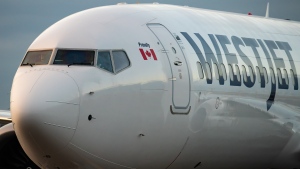 A WestJet Airlines Boeing 737 Max aircraft taxis to a gate after arriving at Vancouver International Airport in Richmond, B.C., on Thursday, January 21, 2021. THE CANADIAN PRESS/Darryl Dyck 