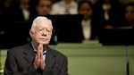 FILE - Former President Jimmy Carter teaches Sunday School class at Maranatha Baptist Church in his hometown, Aug. 23, 2015, in Plains, Ga. In the year since Jimmy Carter first entered home hospice care, the 39th president has celebrated his 99th birthday, enjoyed tributes to his legacy and outlived his wife of 77 years. Rosalynn Carter, who died in November 2023 after suffering from dementia, spent just a few days under hospice. (AP Photo/David Goldman, File)