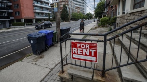 Renters across the country faced record low vacancy rates and record high rent increases in 2023, but Statistics Canada says Toronto and Vancouver residents who don't own their homes face the greatest financial and mental pressures. A "For Rent" sign is posted outside a home in Toronto, Tuesday, July 12, 2022. THE CANADIAN PRESS/Cole Burston