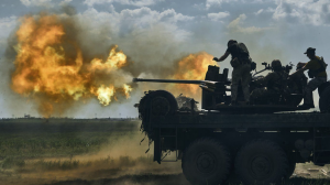 Ukrainian soldiers fire a cannon near the eastern city of Bakhmut in the Donetsk region of Ukraine, Monday, May 15, 2023. (AP Photo/Libkos)