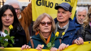 Paola, mother of Giulio Regeni, is flanked by her husband Claudio prior to the start of the trial for the killing of Cambridge University researcher Giulio Regeni, at the Rome's court, Tuesday, Feb. 20, 2024. (AP Photo/Andrew Medichini) 