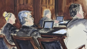 In this courtroom sketch in Federal court, in New York, Tuesday, Feb. 20, 2024, former Honduran President Juan Orlando Hernandez, seated centre at the defense table, is flanked by his attorneys at the start of his trial. (Elizabeth Williams via AP)