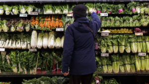 Almost two-thirds of Canadians say they have switched their primary grocery store in the past year to score better deals. A customer shops for produce at a grocery store In Toronto on Friday, Feb. 2, 2024. (THE CANADIAN PRESS/Cole Burston)