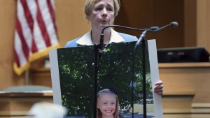 Defense attorney Caroline Smith displays a photograph of Harmony Montgomery to the jury during her closing argument in Adam Montgomery's trial, Wednesday, Feb. 21, 2024, in Manchester, N.H. Montgomery is accused of killing his five-year-old daughter Harmony. (Jim Davis/The Boston Globe via AP, Pool)