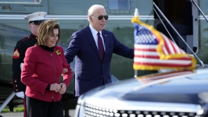 U.S. President Joe Biden escorts Rep. Nancy Pelosi, D-Calif., from Marine One to attend a fundraiser in San Francisco, Wednesday, Feb. 21, 2024. (AP Photo/Manuel Balce Ceneta)
