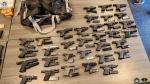 Some of the weapons seized as part of a multi-jurisdictional investigation involving Ontario Provincial Police and U.S. Homeland Security are shown. According to police, 274 illegal firearms were seized as part of the investigation, including 168 in the U.S. and 106 in Ontario. It is believed to be the largest gun seizure in Ontario history. 