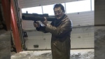 Takeshi Ebisawa handling a rocket launcher. (U.S. Attorney / Southern District of New York)