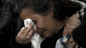 A relative of Matan Elmaliach, 26, reacts during his funeral in the West Bank settlement of Maale Adumim, Thursday, Feb. 22, 2024. (AP Photo/Maya Alleruzzo)