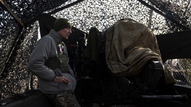 Ukrainian artillery commander Oleksandr, aka "Kirik," smokes a cigarette at a firing position of his 2A36 Giatsint-B in Donetsk region, Ukraine, Feb. 23, 2024. (AP Photo/Alex Babenko)