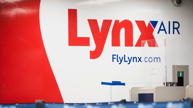 Lynx Air signage is displayed at the John C. Munro Hamilton International Airport in Hamilton, Ont., Friday, February 23, 2024. Officials with the Calgary-based company announced that it is ceasing operations after filing for creditor protection. THE CANADIAN PRESS/Nick Iwanyshyn