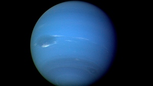 FILE - This August 1989 image provided by NASA shows the planet Neptune photographed by the Voyager 2 spacecraft, processed to enhance the visibility of small features. (NASA via AP)