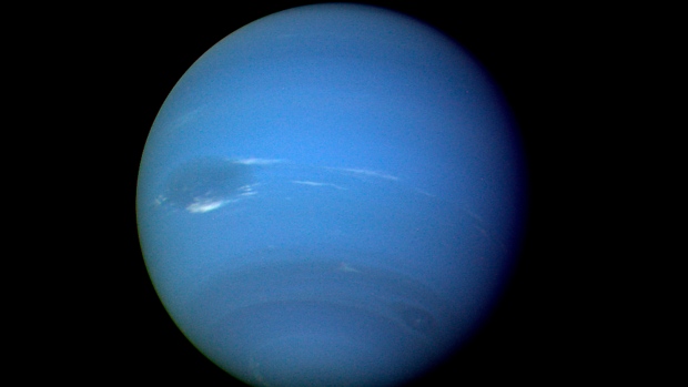 FILE - This August 1989 image provided by NASA shows the planet Neptune photographed by the Voyager 2 spacecraft, processed to enhance the visibility of small features. (NASA via AP)
