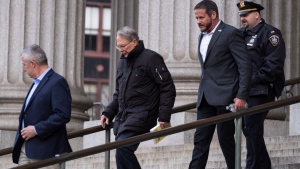 Wayne LaPierre, second from left, CEO of the National Rifle Association, leaves the courthouse as a jury continues deliberations during a trial at New York State Supreme Court in Manhattan, Tuesday, Feb. 20, 2024. (AP Photo/Craig Ruttle)