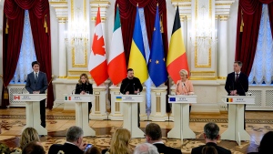 Ukrainian President Volodymyr Zelenskyy, centre, speaks during a joint press conference with from left, Canadian Prime Minister Justin Trudeau, Italy's Premier Giorgia Meloni, EU Commission President Ursula von der Leyen and Belgian Prime Minister Alexander De Croo, at the Mariinskiy Palace in Kyiv, Ukraine, Saturday, Feb. 24, 2024. President Volodymyr Zelenskyy has welcomed Western leaders to Kyiv to mark the second anniversary of Russia's full-scale invasion, as Ukrainian forces run low on ammunition and foreign aid hangs in the balance. (AP Photo/Efrem Lukatsky)