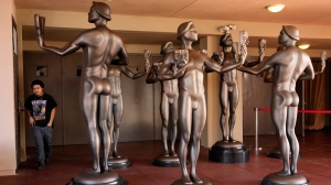 Actor statues stand outside an entrance to the Shrine Auditorium, the site of Saturday's 30th Screen Actors Guild Awards, Thursday, Feb. 22, 2024, in Los Angeles. (AP Photo/Chris Pizzello)