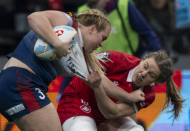 Canada's Sophie De Goede grabs Great Britain's Abi Burton during Vancouver Sevens women's rugby action, in Vancouver, on Friday, Feb. 23, 2024. THE CANADIAN PRESS/Ethan Cairns
