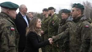 Defence Minister Bill Blair says Canada has asked the Ukrainian government how it can help, while its donation of an air-defence system faces indefinite delays. Canada's Deputy Prime Minister and Minister of Finance Chrystia Freeland, center, and the Minister of National Defence Bill Blair, second left, talk to Polish and Canadian troops during a joint exercise that provides training to soldiers from Ukraine near Jezewo, central Poland, Sunday, Feb. 25, 2024. THE CANADIAN PRESS/AP-Czarek Sokolowski