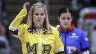 Team Manitoba-Jones skip Jennifer Jones, left, reacts to her teammate's shot as Team Manitoba-Cameron skip Kate Cameron looks on in the semifinal at the Scotties Tournament of Hearts in Calgary, Alta., Sunday, Feb. 25, 2024. THE CANADIAN PRESS/Jeff McIntosh