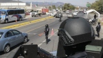 State police maintain a security checkpoint at the entrance of Chilpancingo, Mexico, Thursday, Feb. 15, 2024. (AP Photo/Alejandrino Gonzalez)