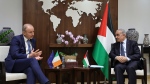 Irish Defence and Foreign Affairs Minister Micheal Martin, left, meets with Palestinian prime minister Mohammad Shtayyeh in the West Bank city of Ramallah on Thursday, Nov. 16, 2023. (Zain Jaafar/Pool Photo via AP)