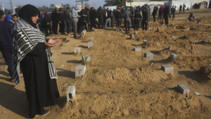 A Palestinian woman prays for a relative killed in the Israeli bombardment of the Gaza Strip in Khan Younis on Monday, Feb. 26, 2024. (AP Photo/Hatem Ali)