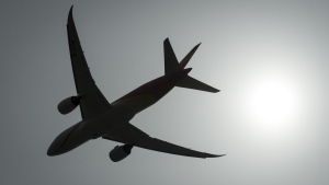 A plane is silhouetted as it takes off from Vancouver International Airport in Richmond, B.C., Monday, May 13, 2019. THE CANADIAN PRESS/Jonathan Hayward
