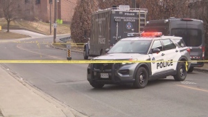 Police tape is show at the scene of a homicide investigation on Hickory Tree Road in Toronto's west end on Feb. 27. (CP24)