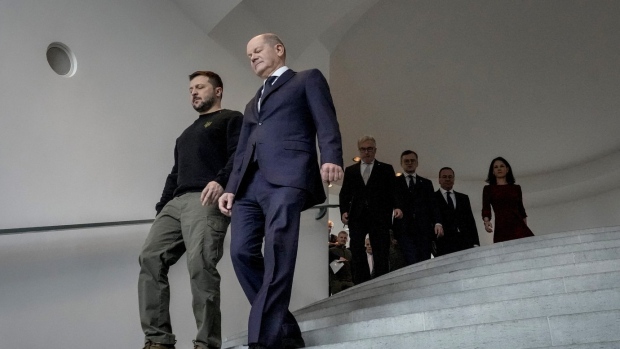 German Chancellor Olaf Scholz, right, and Ukrainian President Volodymyr Zelenskyy walk down the stairs in the chancellory during a meeting in Berlin, Friday, Feb. 16, 2024. German Chancellor Olaf Scholz has emphasized his reluctance to send Taurus long-range cruise missiles to Ukraine, pointing to a risk of his country becoming directly involved in the war. Germany is now the second-biggest supplier of military aid to Ukraine after the United States and is stepping up aid to Kyiv. (AP Photo/Markus Schreiber, File)