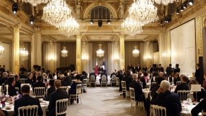 French President Emmanuel Macron delivers a speech during a state dinner with Qatar's Emir Sheikh Tamim bin Hamad Al Thani at the Elysee Palace in Paris, Feb. 27, 2024. (Yoan Valat, Pool via AP)