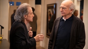 This image released by HBO shows Richard Lewis, left, with Larry David in a scene from Season 10 of "Curb Your Enthusiasm." Lewis, an acclaimed comedian known for exploring his neuroses in frantic, stream-of-consciousness diatribes while dressed in all-black, leading to his nickname 'The Prince of Pain,' has died. He was 76. He died at his home in Los Angeles on Tuesday night after suffering a heart attack, according to his publicist Jeff Abraham. (John P. Johnson/HBO via AP)