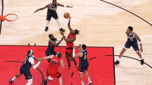 Toronto Raptors' Immanuel Quickley shoots on the Dallas Mavericks defence during first half NBA basketball action in Toronto on Wednesday, February 28, 2024. THE CANADIAN PRESS/Chris Young