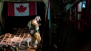A member of the Air Task Force IMPACT, Air Move Detachment conducts his duties in a CC-130 Hercules aircraft, in Iraq on January 30, 2022. (Credit: Canadian Armed Forces)