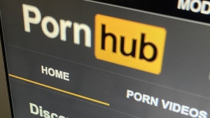 The federal privacy watchog says the operator behind Pornhub and other pornographic sites broke the law by enabling intimate images to be shared on its websites without direct knowledge or consent. The Pornhub website is shown on a computer screen in Toronto on Wednesday, Dec. 16, 2020. THE CANADIAN PRESS