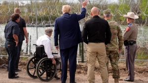 Republican presidential candidate former President Donald Trump waves to people across the Rio Grande in Mexico, at Shelby Park during a visit to the U.S.-Mexico border, Thursday, Feb. 29, 2024, in Eagle Pass, Texas. (Eric Gay / AP Photo)