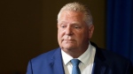 FILE - Ontario Premier Doug Ford enters a room to speak to journalists at the Queen's Park Legislature in Toronto on Tuesday, September 5, 2023. THE CANADIAN PRESS/Chris Young 