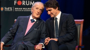 Prime Minister Justin Trudeau, right, and former prime minister Brian Mulroney speak during the Atlantic Economic Forum at St. Francis Xavier University in Antigonish, N.S. on Monday, June 19, 2023. THE CANADIAN PRESS/Darren Calabrese 