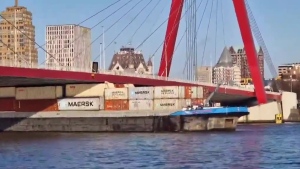 Container barge stuck under Rotterdam bridge