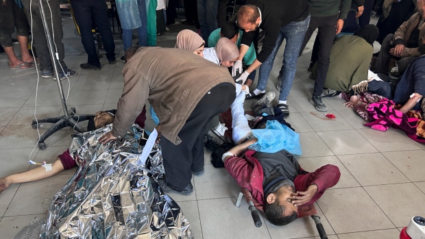 Palestinians wounded in an Israeli strike while waiting for humanitarian aid on the beach in Gaza City are treated in Shifa Hospital on Thursday, Feb. 29, 2024. (AP Photo/Mahmoud Essa)
