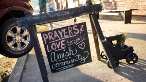 A sign on the sidewalk outside an antique store in Spartansburg, Pa., on Thursday, Feb. 29, 2024. Shawn C. Cranston was arrested Saturday, March 2, and charged with the slaying of a pregnant Amish woman whose body was found last week. (AP Photo/Gene J. Puskar)