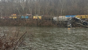 This photo provided by Nancy Run Fire Company shows a train derailment along a riverbank in Saucon Township, Pa., on Saturday, March 2, 2024. Authorities said it was unclear how many cars were involved but no injuries or hazardous materials were reported. (Nancy Run Fire Company via AP)