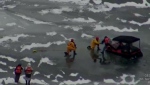 Rescuers remove one occupant of a collapsed side-by-side vehicle on Lake Simcoe. (OPP)